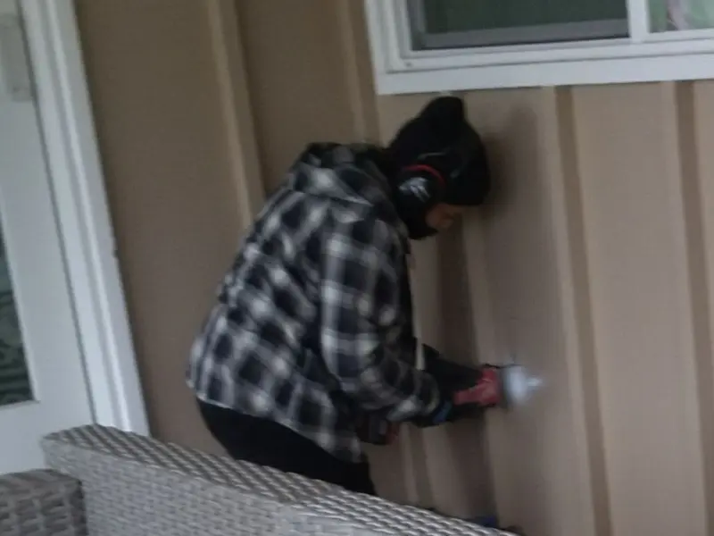 Professional electrician installing an exterior outlet in Linganore