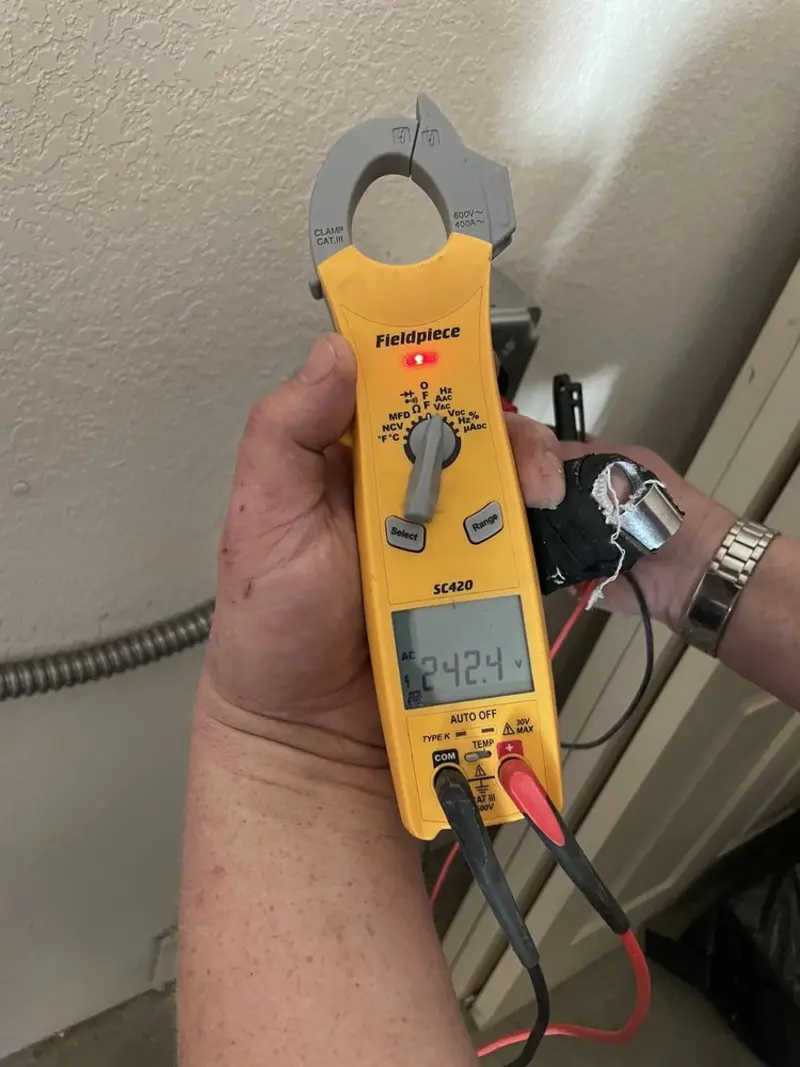 Voltage testing with clamp meter during Ceiling Fan Installation in Linganore